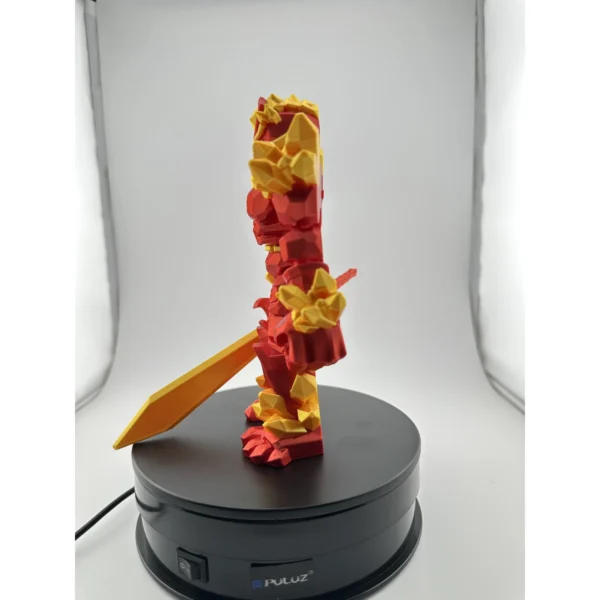 Crystal Warrior Candy Red / Gold – boční pohled Červeno-zlatý Crystal Warrior s odnímatelným mečem při pohledu z boku.